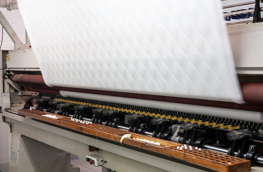 Home linen coming off a machine at Romatex textile industry